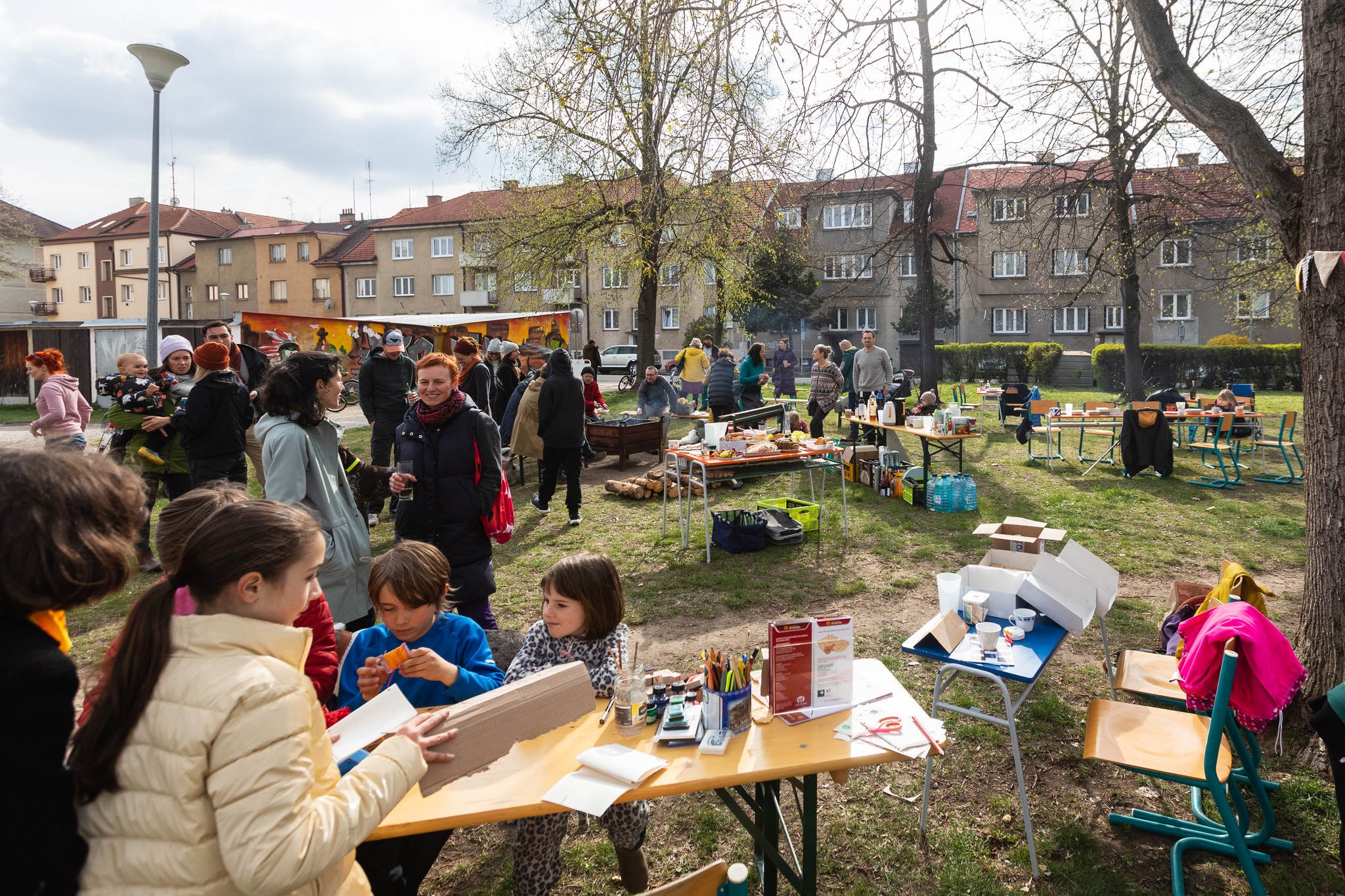 Children and adults gathered in park.